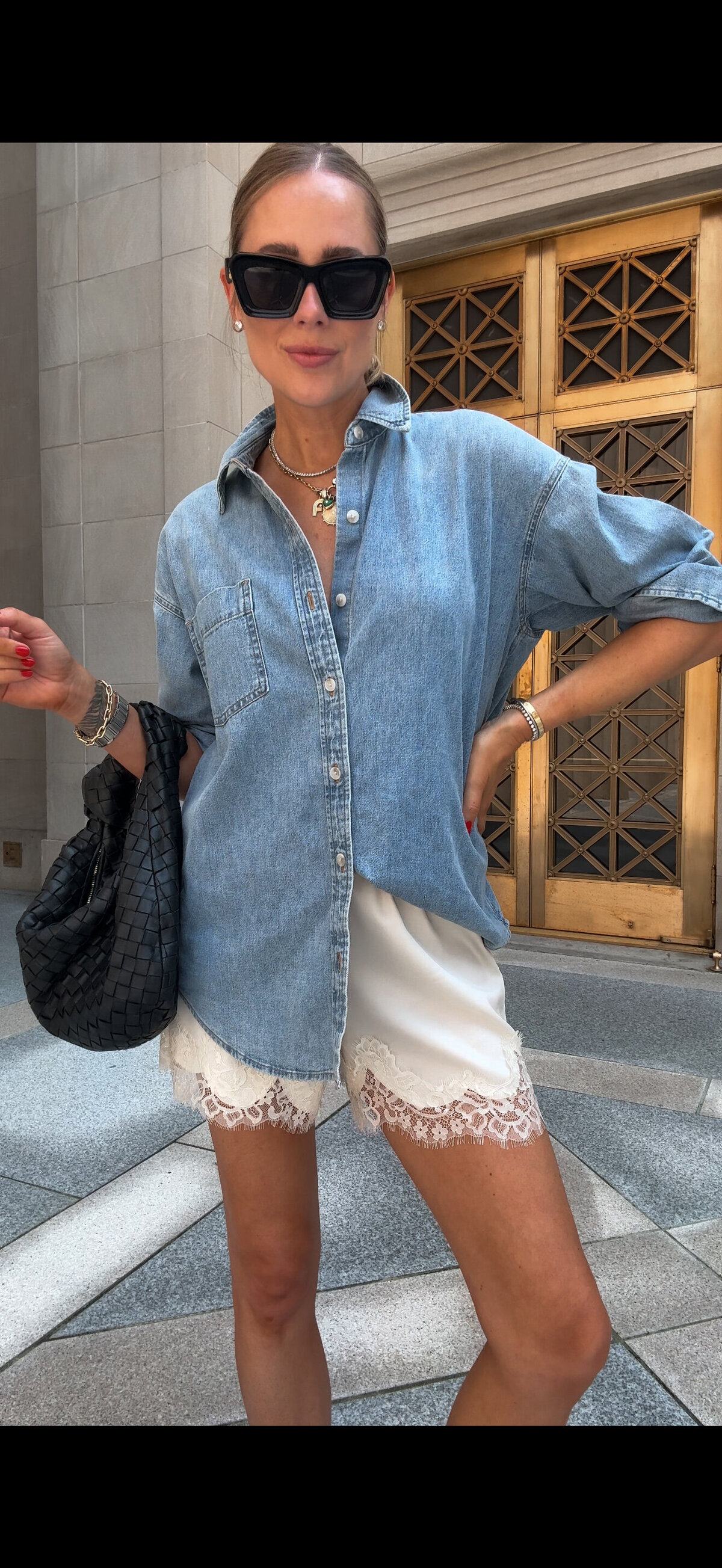 A blue denim shirt with white shorts